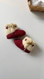نیم بوت خز دکمه دار